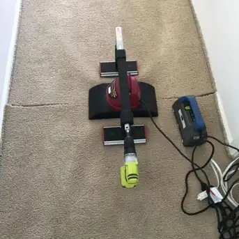 The same hallway mid-stretch, part of the wrinkle already pulled out